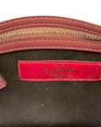 Valentino Rockstud clutch with rivets and elaborate beadwork