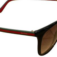 Gucci sunglasses with signature temples