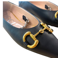 Gucci pointed ballerinas with signature horsebit details and silver plated chain