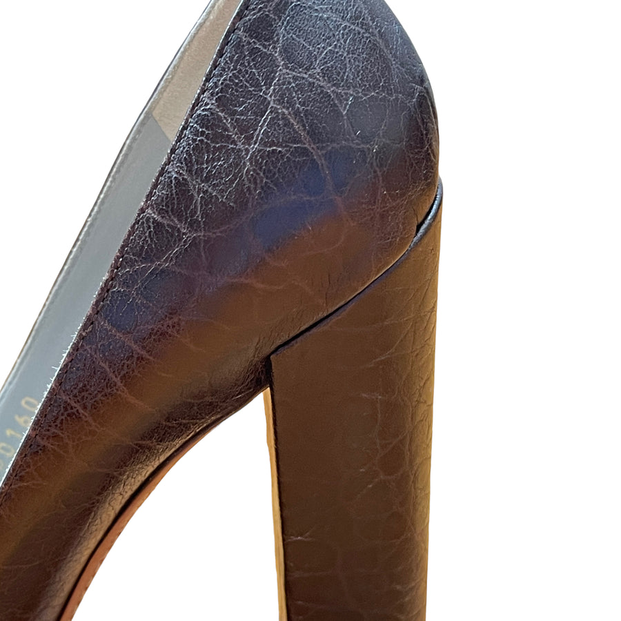 Louis Vuitton lace embossed pumps with bow details