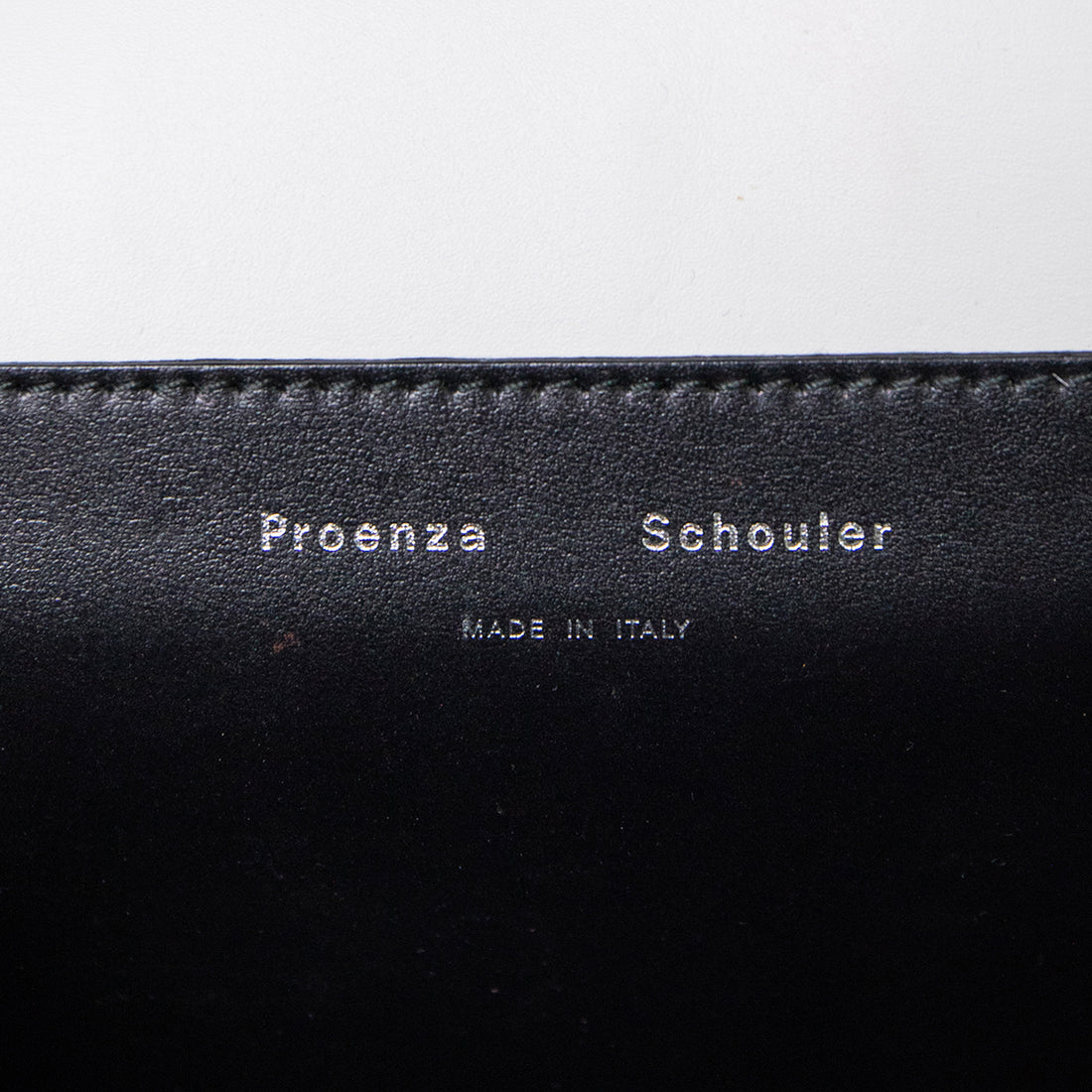 Proenza Schouler clutch with signature closure