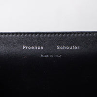 Proenza Schouler clutch with signature closure