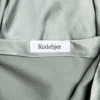 Rodebjer high-cut blouse with wrap collar