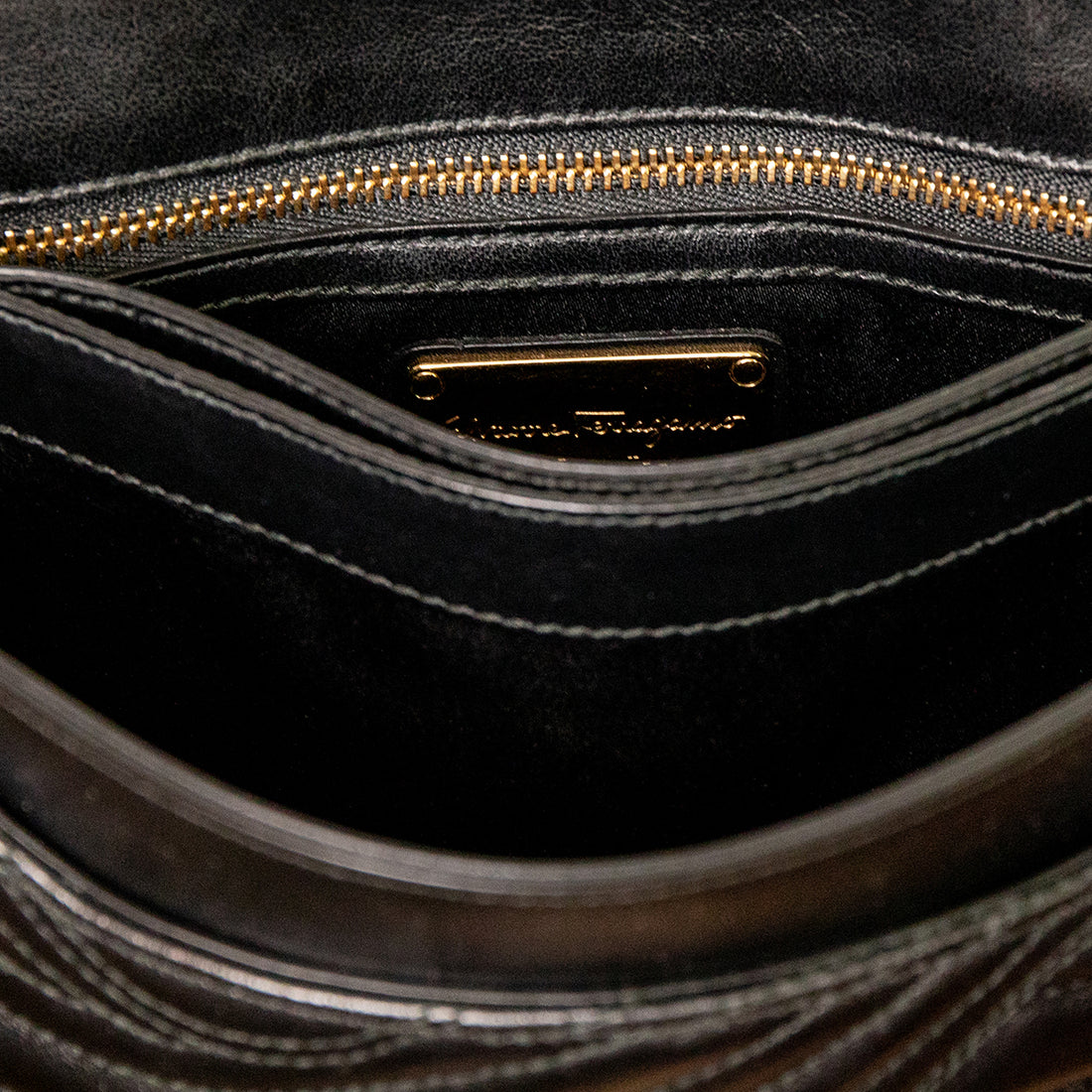 Salvatore Ferragamo Black quilted shoulder bag with gold embellishments