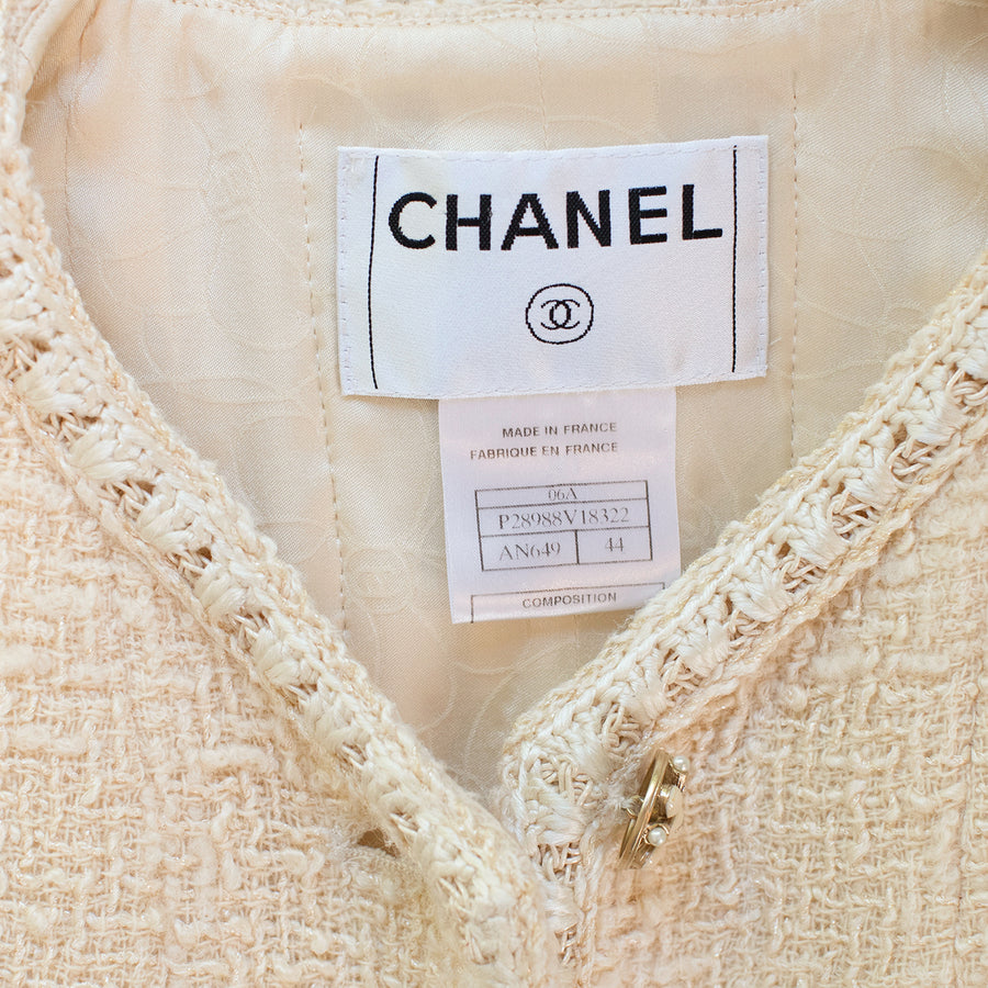Chanel Boucle jacket with patch pockets and beaded logo buttons