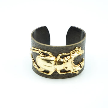 Ileana Makri cuff in oxidized brass with gold plated scarab